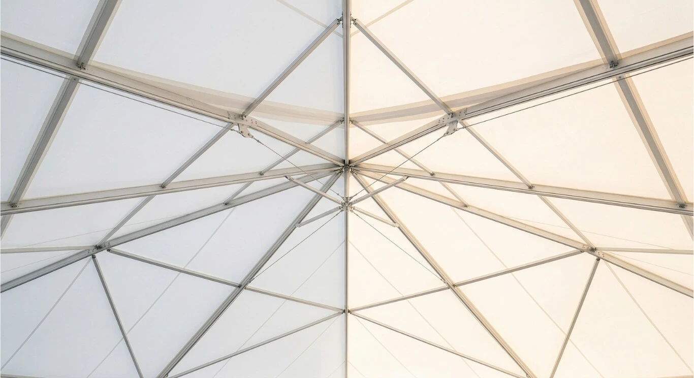 Interior view looking up at a tent ceiling setup by Luvo Events