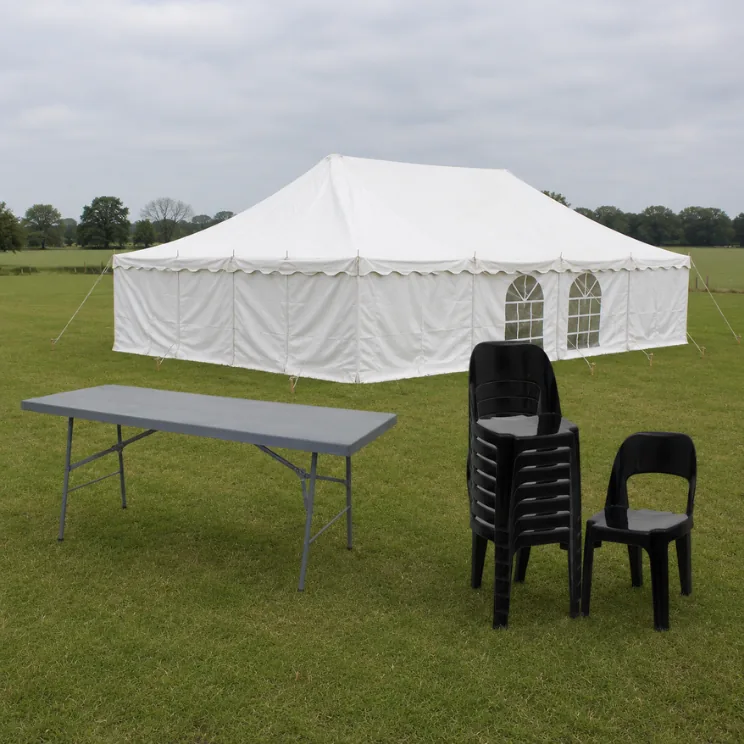 A white 2-pole tent, folding table and black plastic chairs hired together from Luvo Events in Durban